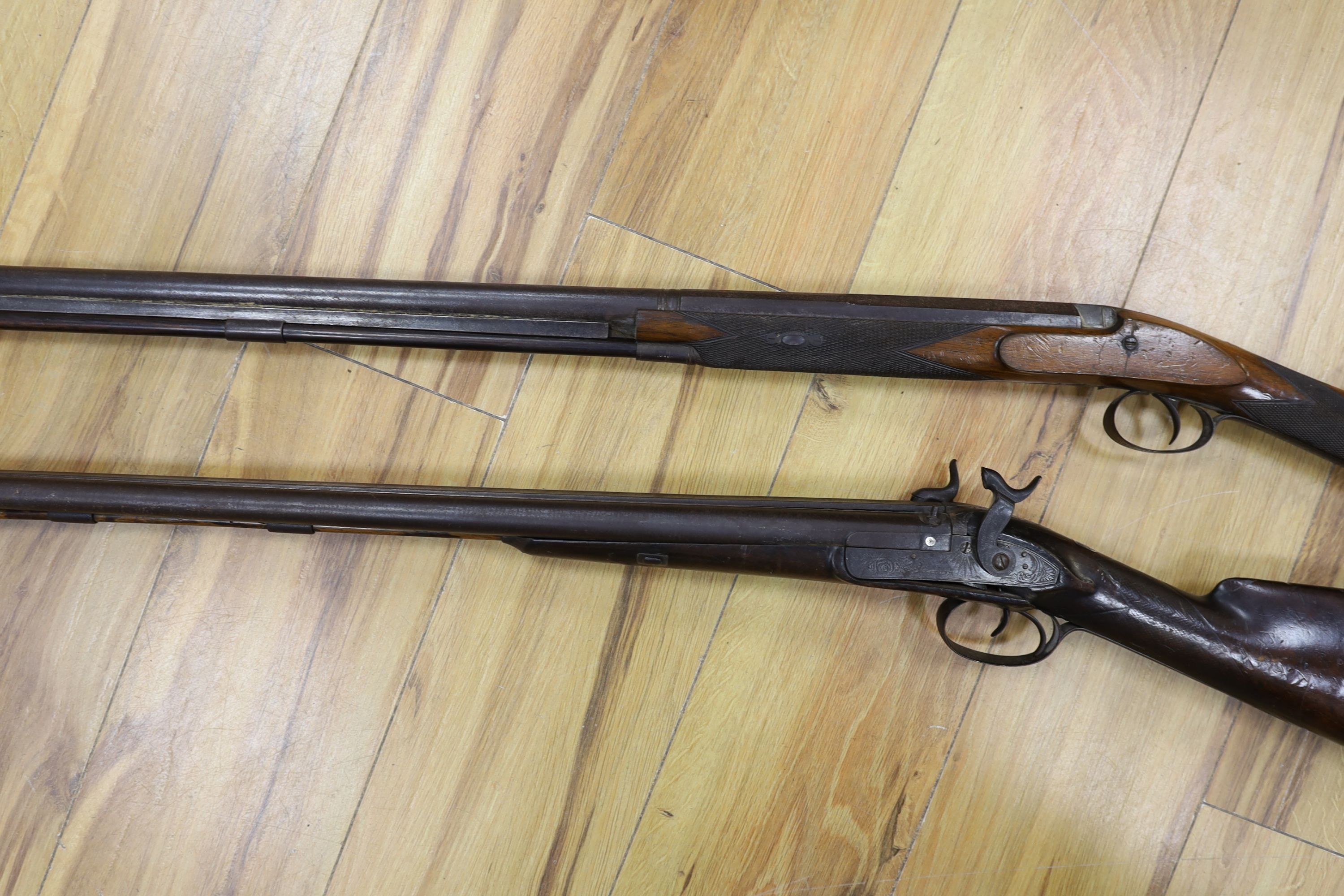 Two 19th century percussion muskets, 103cm. max., one double-barrelled